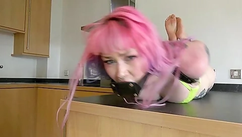 Captured Stripper hogtied on table pt1