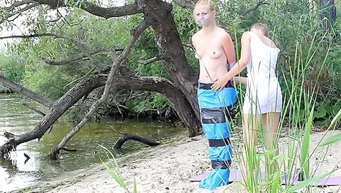 Girl Tied And Gagged In Trashbags On The Beach